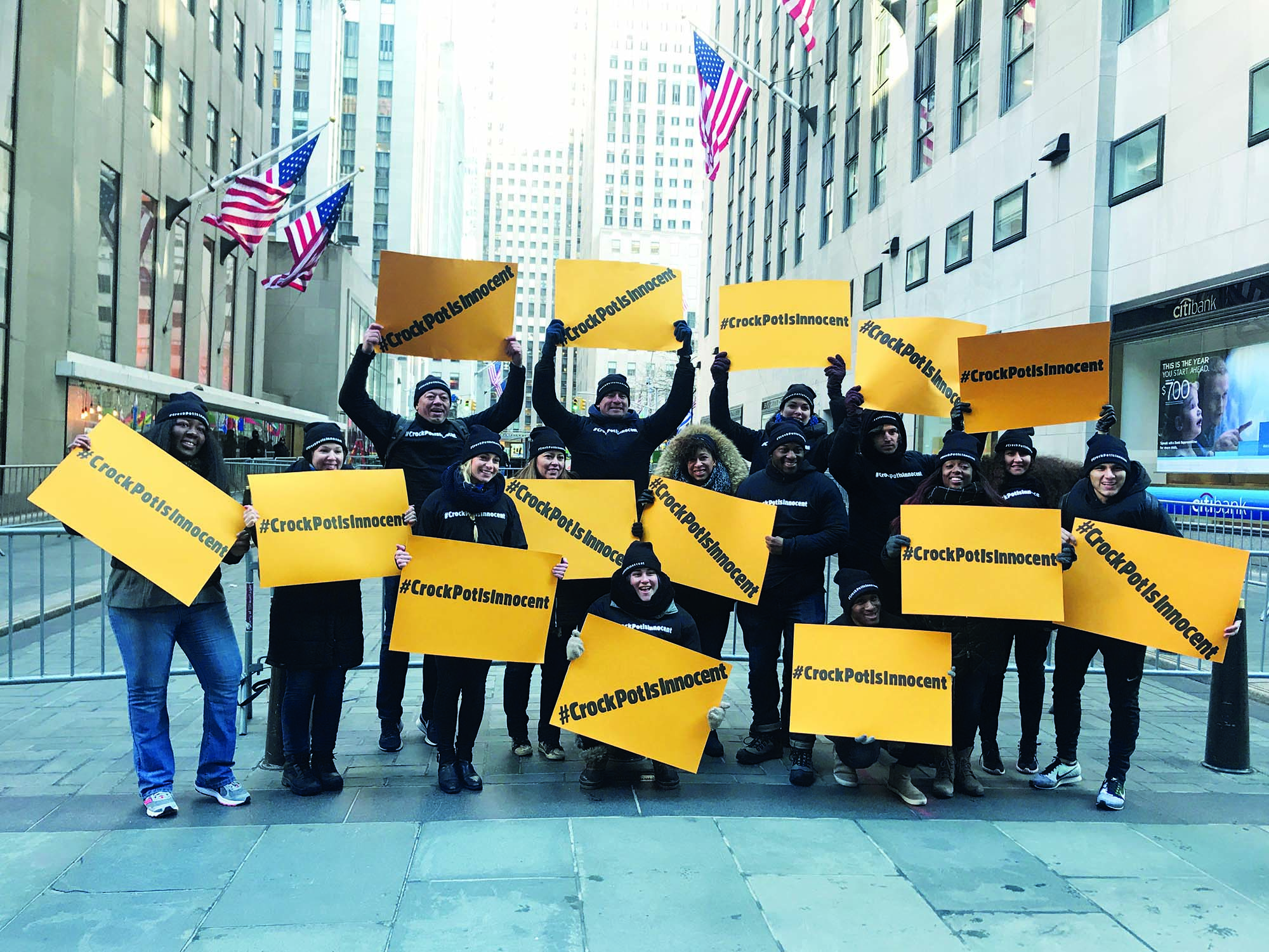 #CrockPotIsInnocent Crowd holding posters that read "#CrockPotIsInnocent"