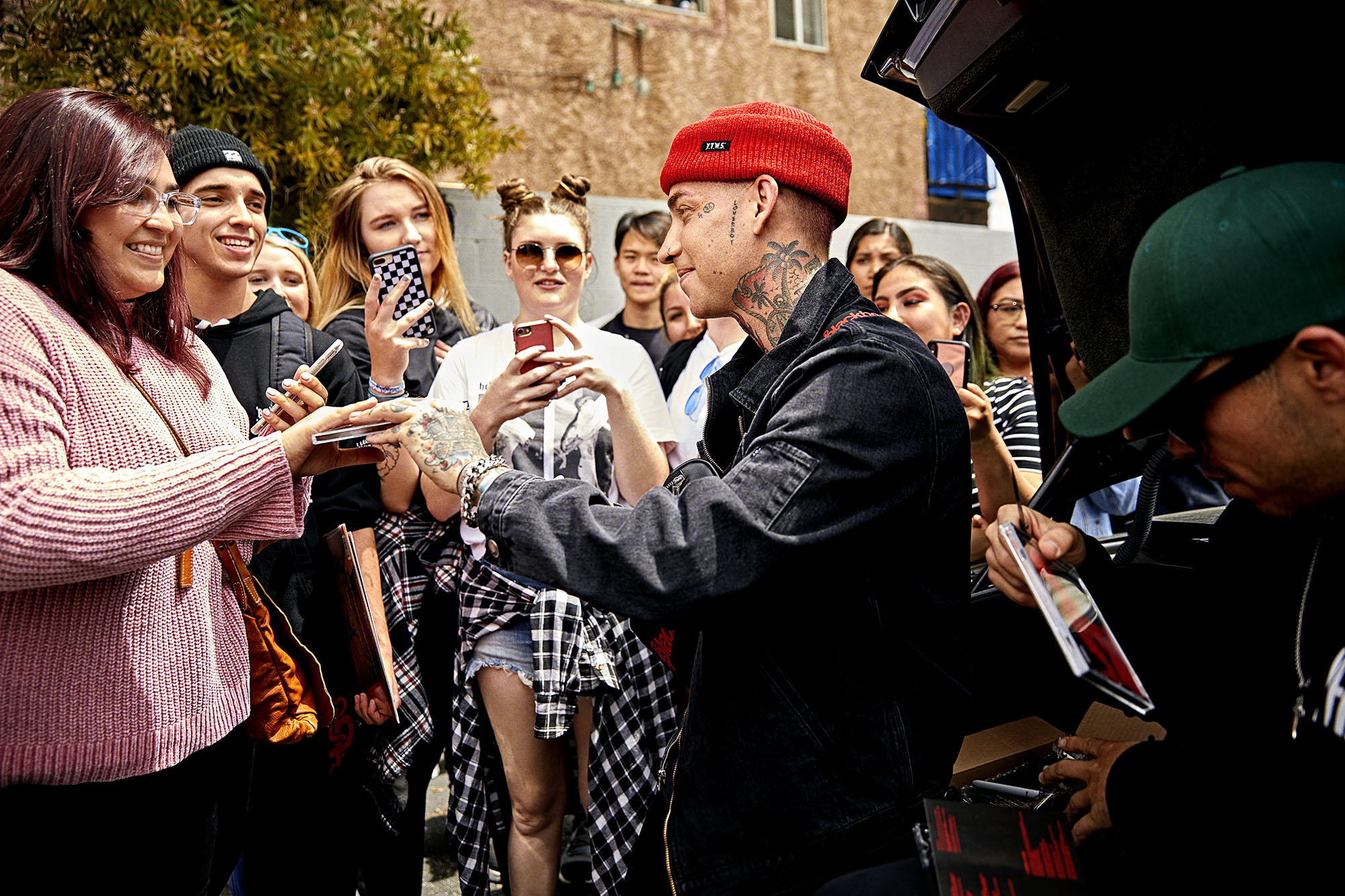 Twitter music fans Music fans getting autographs from entertainer.